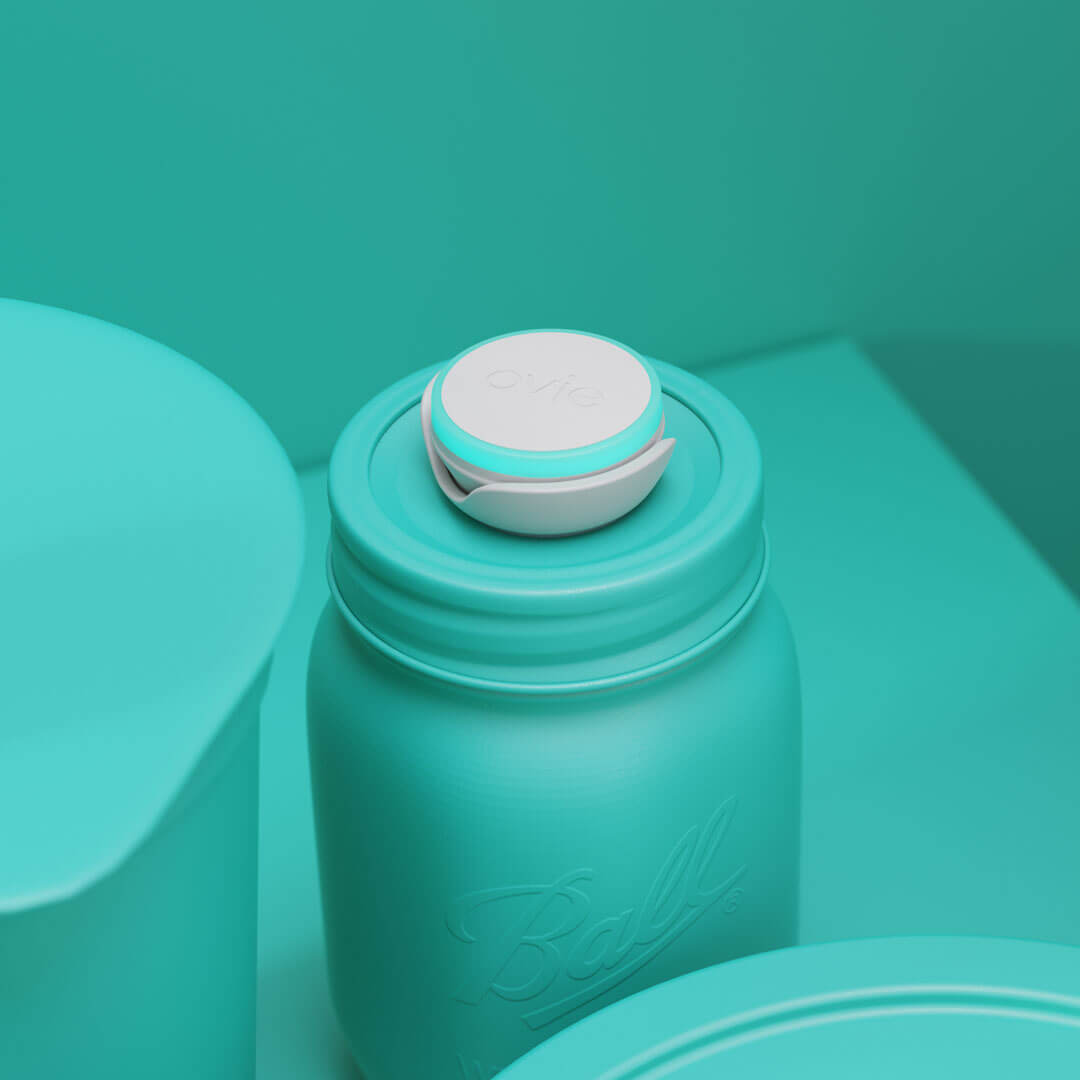 Closeup stylized rendering of Ovie LightTag on top of Ball Jar. Background and food in rendering are all colored teal
