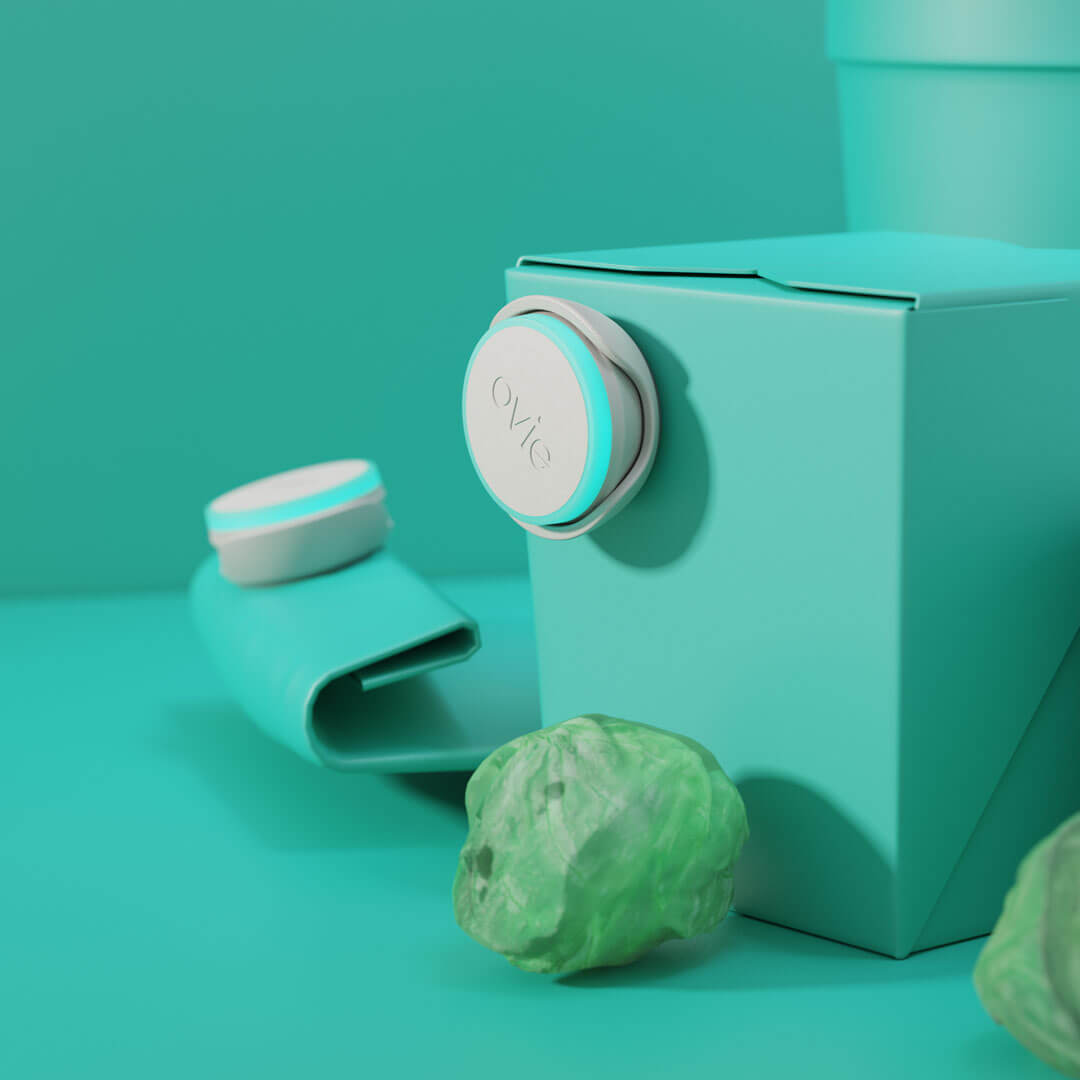 Stylized teal-themed image highlighting 2 Ovie LightTags on food containers that are also teal