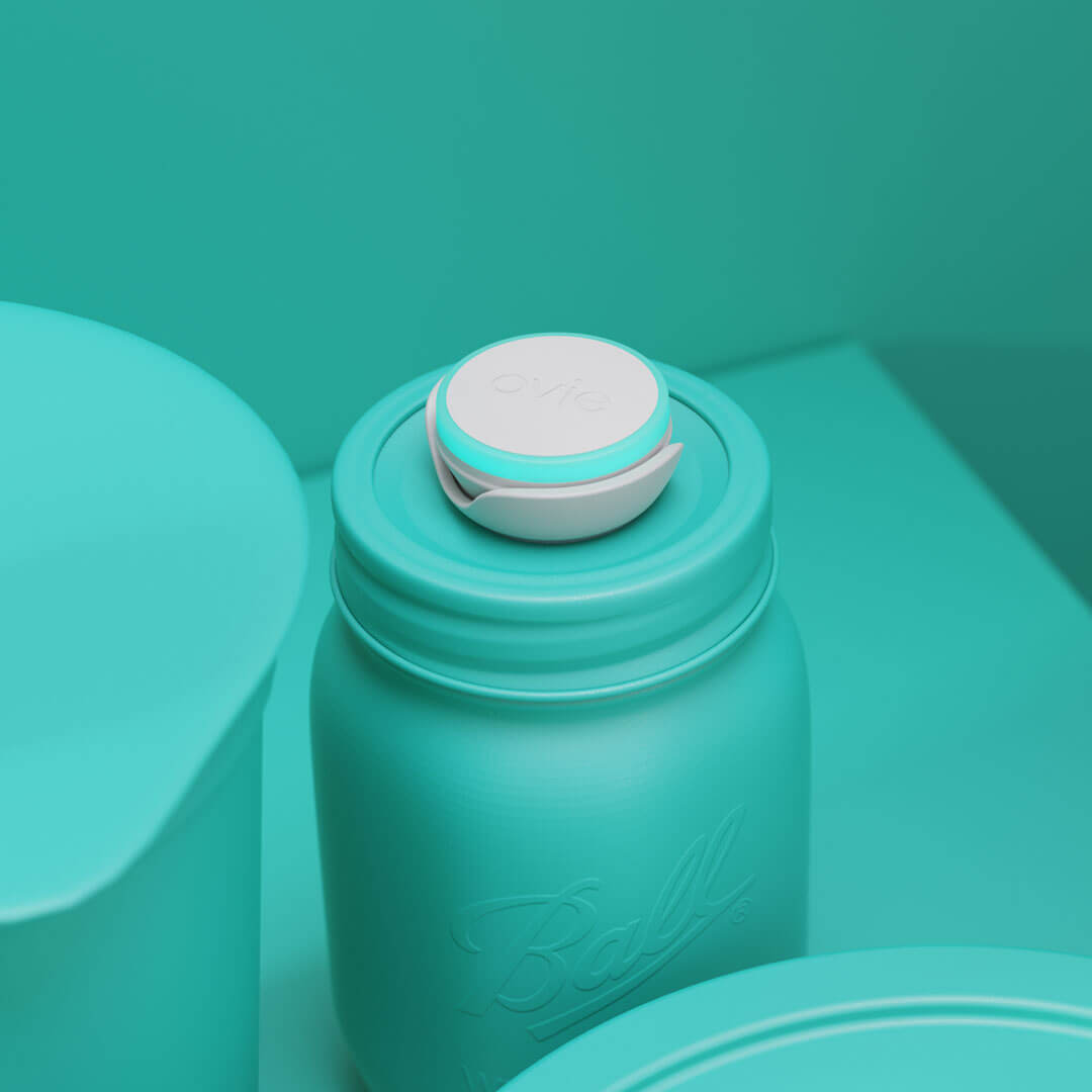 Closeup stylized rendering of Ovie LightTag  on top of Ball Jar. Background and food in rendering are all colored teal