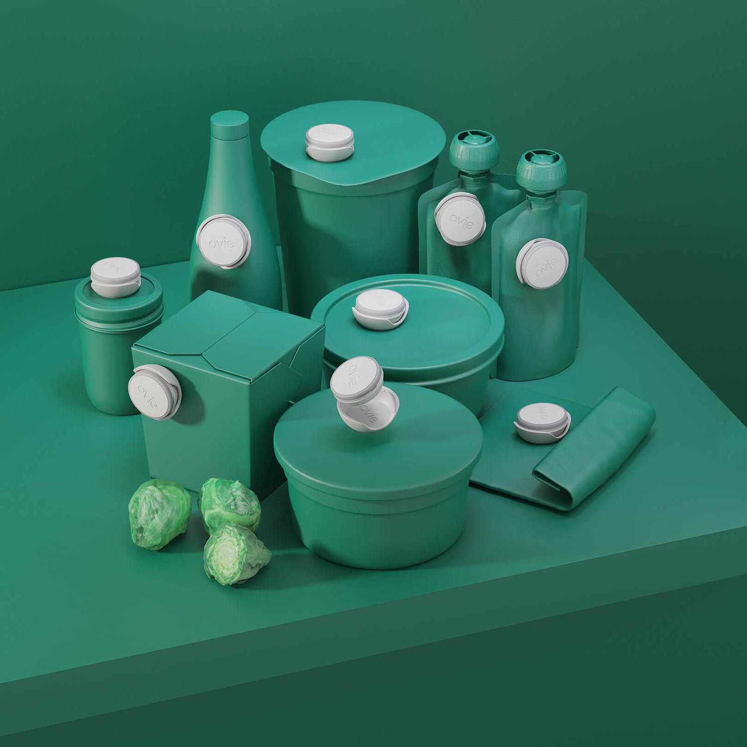 Stylized dark green image with 9 Ovie LightTags placed on various food-shaped containers that match the background. All LightTags are unlit
