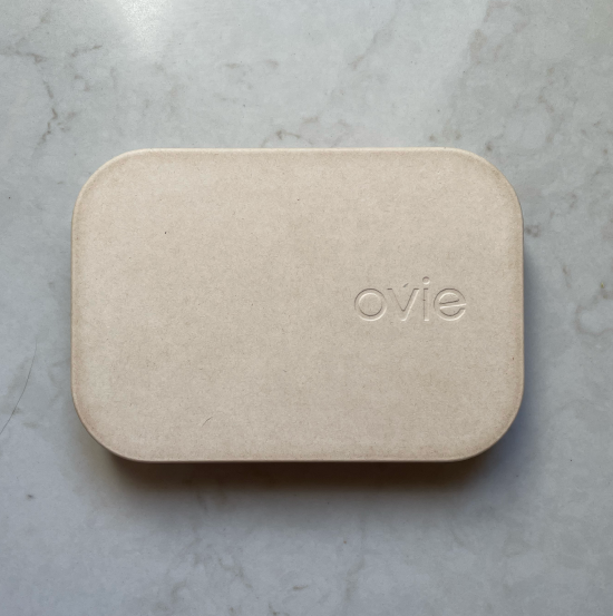 Photo of Ovie compostable packaging on marble countertop