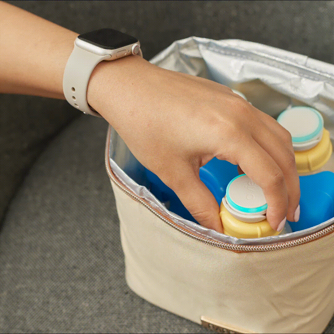 Gif of woman who saves expressed breastmilk into small cooler bag and then puts into the fridge with Ovie LightTags on every bottle. 